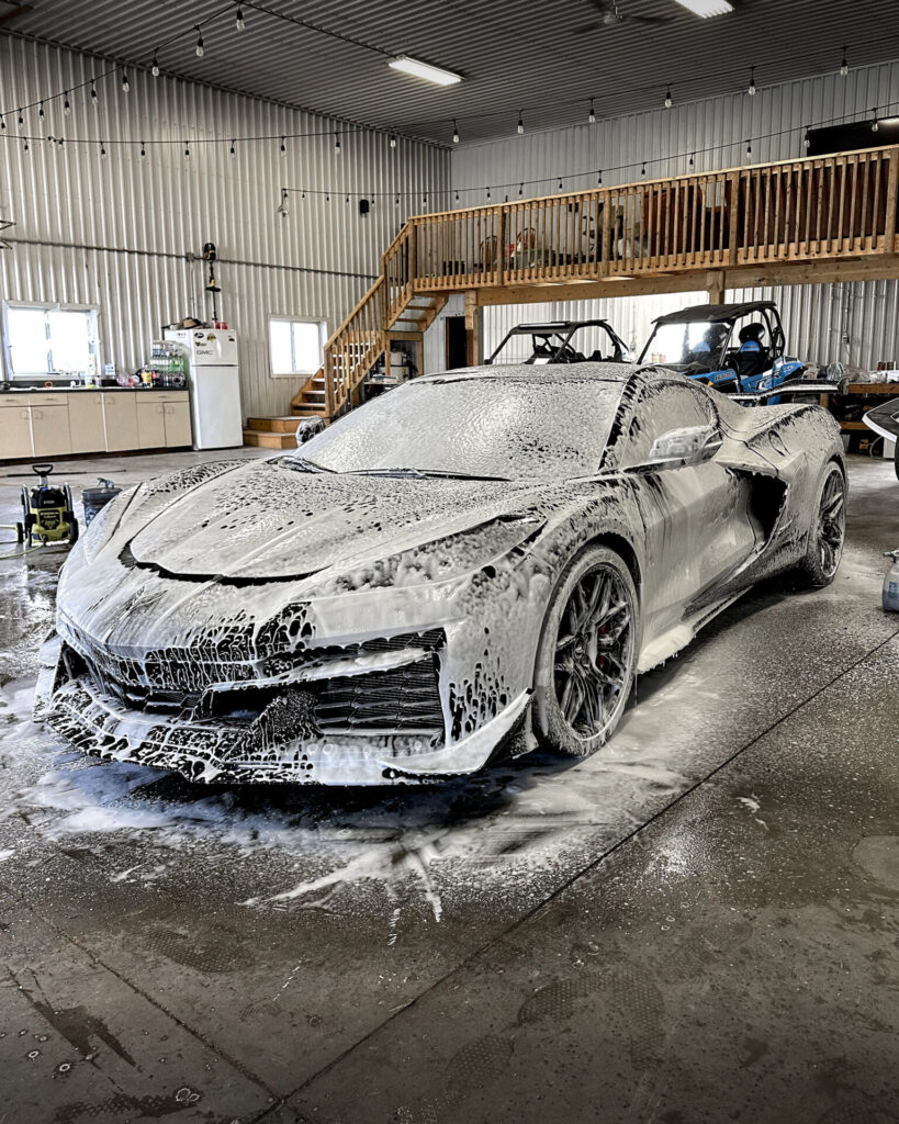 Black 2024 Chevy Corvette C8 ZO6 - Driver Front Half Foamy during Mobile Detailing and Ceramic Coating