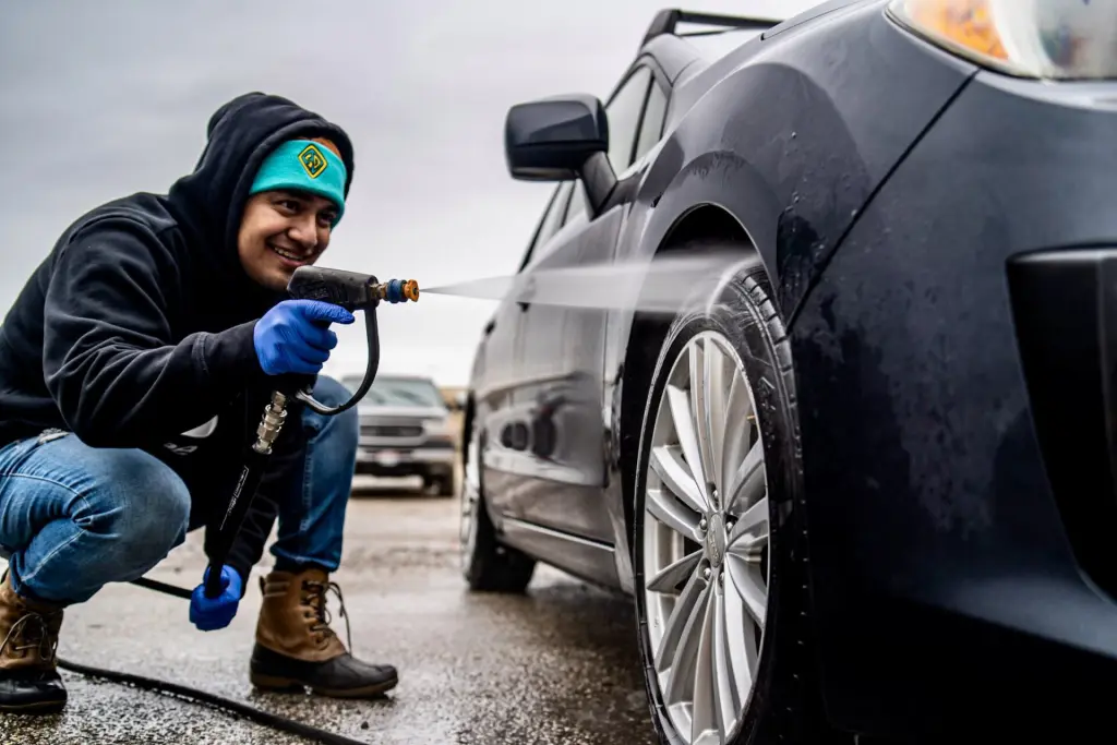 Marco from Diaz Mobile Detailing pressure washing a wheel 1