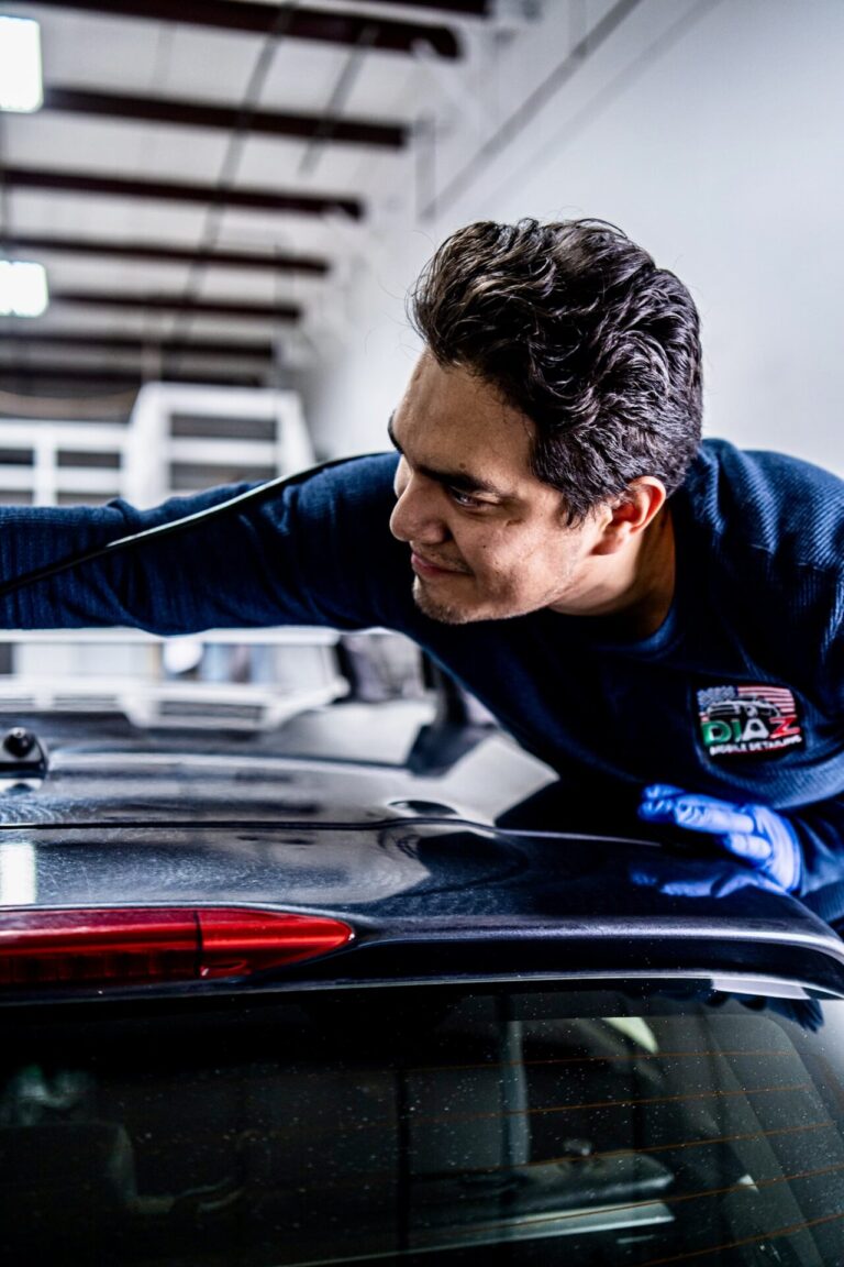 Marco from Diaz Mobile Detailing polishing a car roof 4