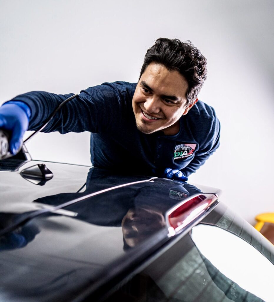 Marco from Diaz Mobile Detailing polishing a car roof 5