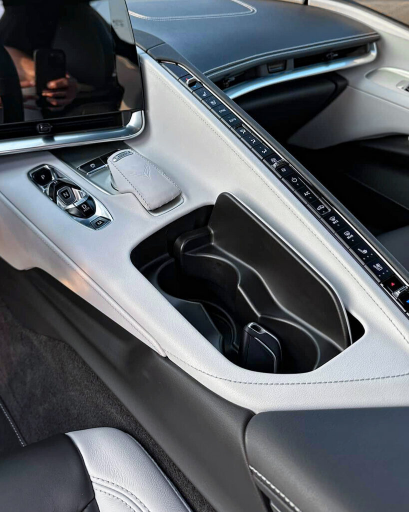 White 2024 Chevy Corvette C8 - Driver Centre Console after Mobile Detailing