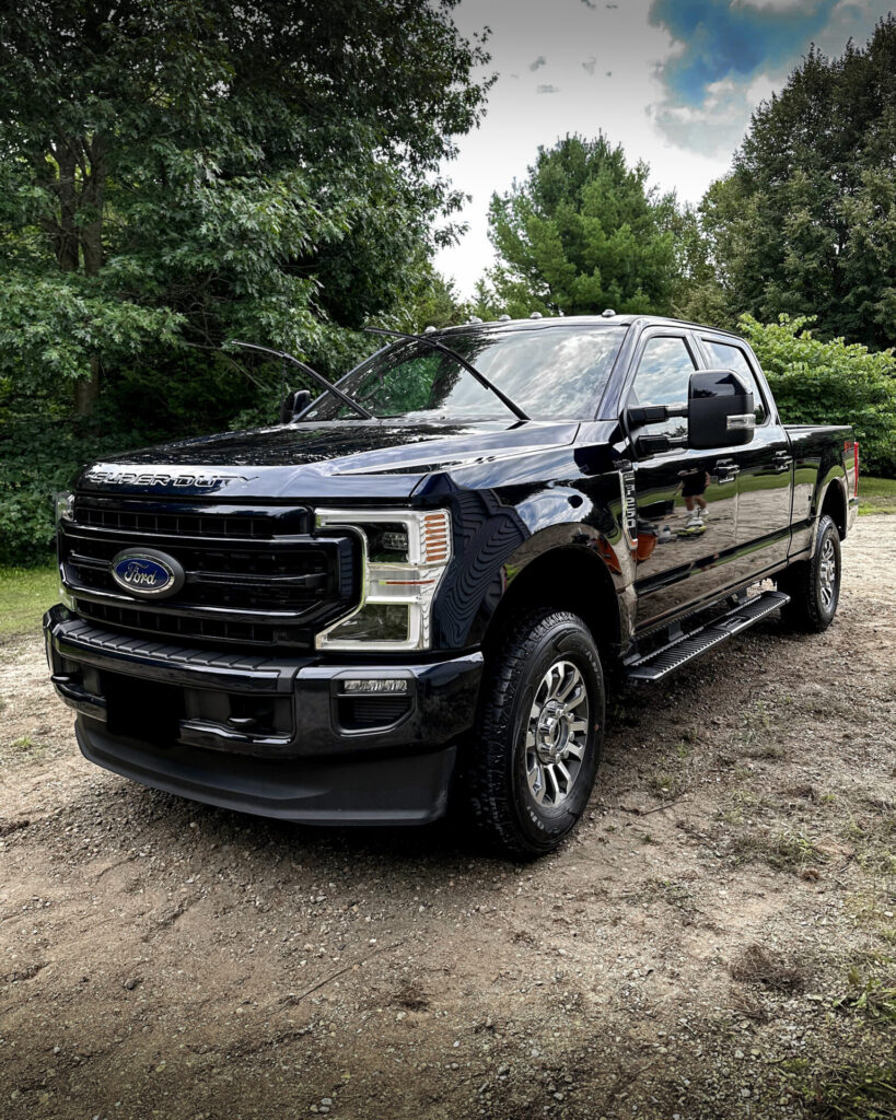 Black 2024 Ford F250 - Driver Front Half after Mobile Detailing and Ceramic Coating