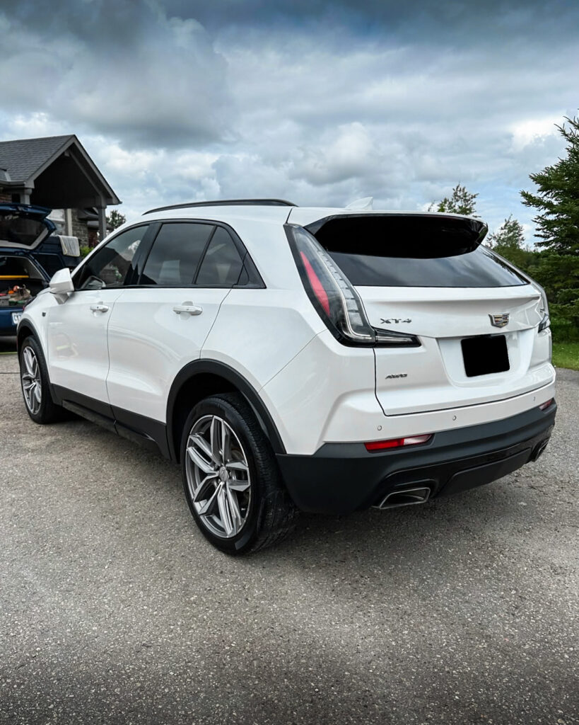 White 2023 Cadillac XT4 - Driver Rear after Mobile Detailing